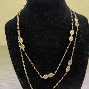 Doubled, long strand; may be worn singly.